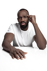 Image showing Close up portrait of a young african man indoors