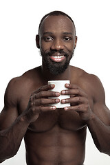 Image showing African man with cup of tea, isolated on white background