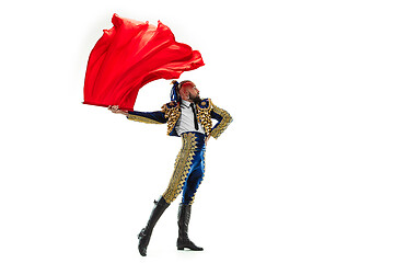 Image showing Torero in blue and gold suit or typical spanish bullfighter isolated over white