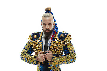 Image showing Torero in blue and gold suit or typical spanish bullfighter isolated over white