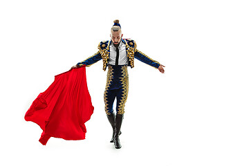 Image showing Torero in blue and gold suit or typical spanish bullfighter isolated over white