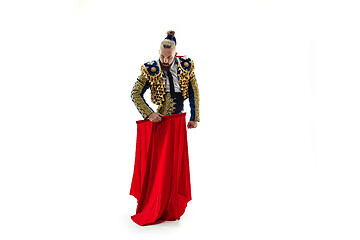 Image showing Torero in blue and gold suit or typical spanish bullfighter isolated over white