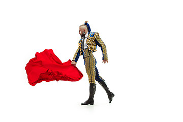 Image showing Torero in blue and gold suit or typical spanish bullfighter isolated over white