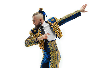 Image showing Torero in blue and gold suit or typical spanish bullfighter isolated over white