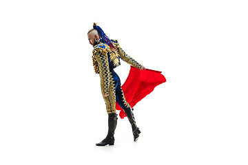 Image showing Torero in blue and gold suit or typical spanish bullfighter isolated over white