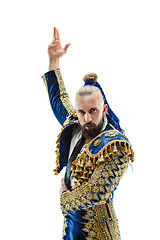 Image showing Torero in blue and gold suit or typical spanish bullfighter isolated over white