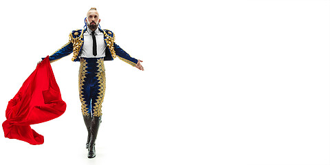 Image showing Torero in blue and gold suit or typical spanish bullfighter isolated over white