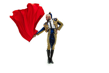 Image showing Torero in blue and gold suit or typical spanish bullfighter isolated over white