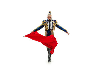 Image showing Torero in blue and gold suit or typical spanish bullfighter isolated over white