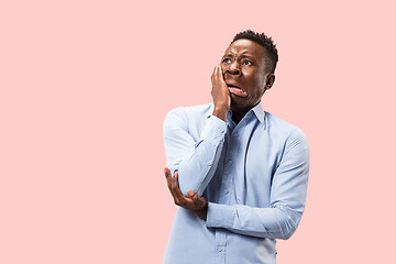 Image showing Young boy with a surprised expression bet slip on pink background