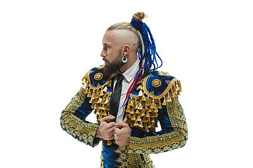 Image showing Torero in blue and gold suit or typical spanish bullfighter isolated over white