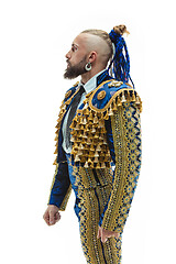 Image showing Torero in blue and gold suit or typical spanish bullfighter isolated over white