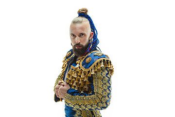 Image showing Torero in blue and gold suit or typical spanish bullfighter isolated over white