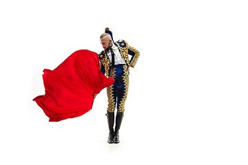 Image showing Torero in blue and gold suit or typical spanish bullfighter isolated over white