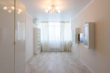 Image showing Interior of a bedroom partially freed from furniture due to relocation