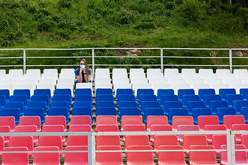 Image showing Lonely woman on the empty stadium outdoor