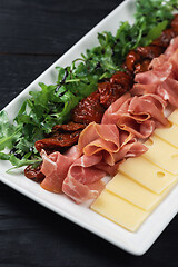 Image showing prosciutto cheese and sun-dried tomatoes
