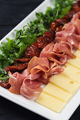 Image showing prosciutto cheese and sun-dried tomatoes