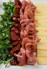 Image showing prosciutto cheese and sun-dried tomatoes