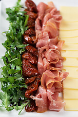 Image showing prosciutto cheese and sun-dried tomatoes