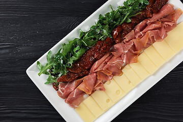 Image showing prosciutto cheese and sun-dried tomatoes