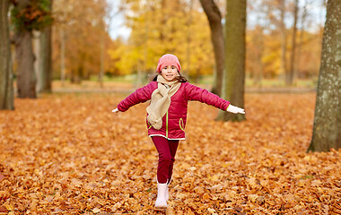 Image showing happy girl running at autumn park