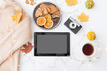 Image showing tablet computer, camera, autumn leaves and garland