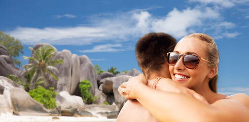 Image showing happy couple hugging on summer beach