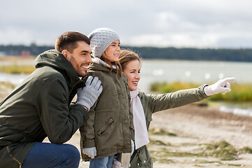 Image showing happy family on autumn beach