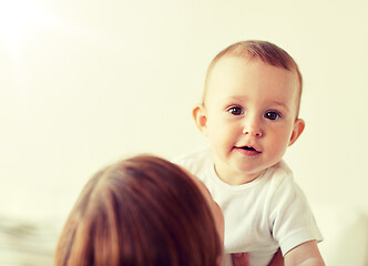 Image showing happy little baby with mother at home