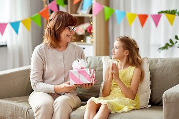 Image showing grandmother giving granddaughter birthday gift