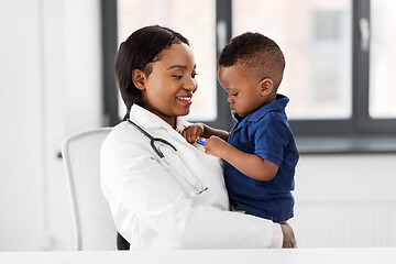 Image showing doctor or pediatrician with baby patient at clinic