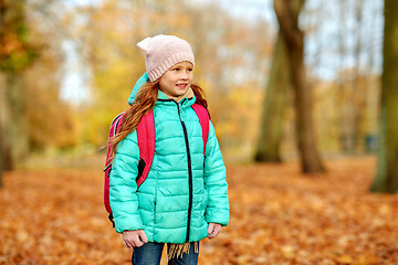 Image showing happy student girl with schoolbag at autumn park