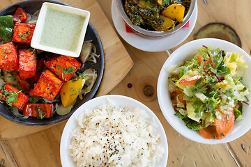 Image showing various food on table of indian restaurant