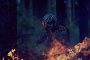 Image showing soldier in action aiming  on weapon  laser sight optics