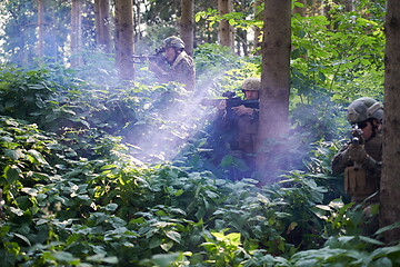 Image showing Modern warfare Soldiers  Squad  in battle