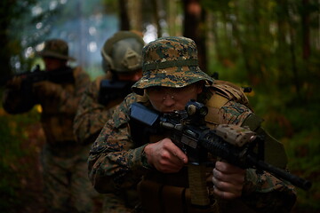 Image showing Modern warfare Soldiers  Squad  in battle