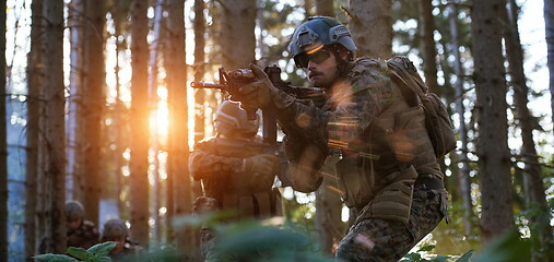 Image showing Modern warfare Soldiers  Squad  in battle