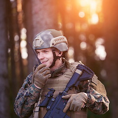 Image showing Officer Talking Portable Radio Station