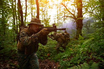 Image showing Modern warfare Soldiers  Squad  in battle