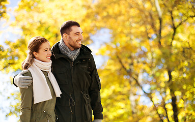 Image showing smiling couple hugging in autumn park