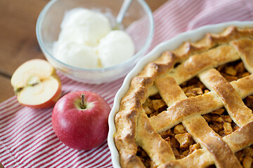 Image showing apple pie with ice cream on wooden table