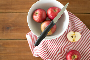 Image showing apples and kitchen knife on towel