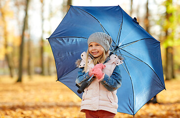 Image showing happy little girl with umbrella at autumn park