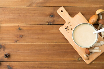 Image showing mushroom cream soup in bowl on cutting board