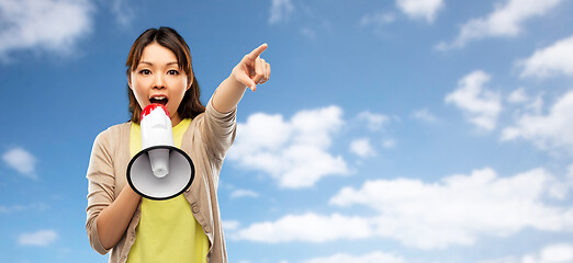 Image showing asian woman speaking to megaphone