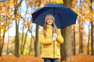 Image showing happy girl with umbrella at autumn park