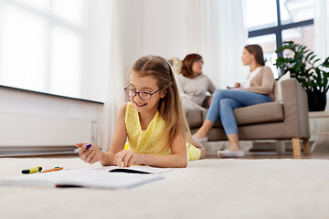 Image showing student girl writing to notebook at home