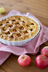 Image showing apple pie in baking mold on wooden table