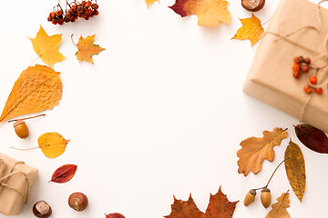 Image showing frame of gifts, autumn leaves and rowanberry